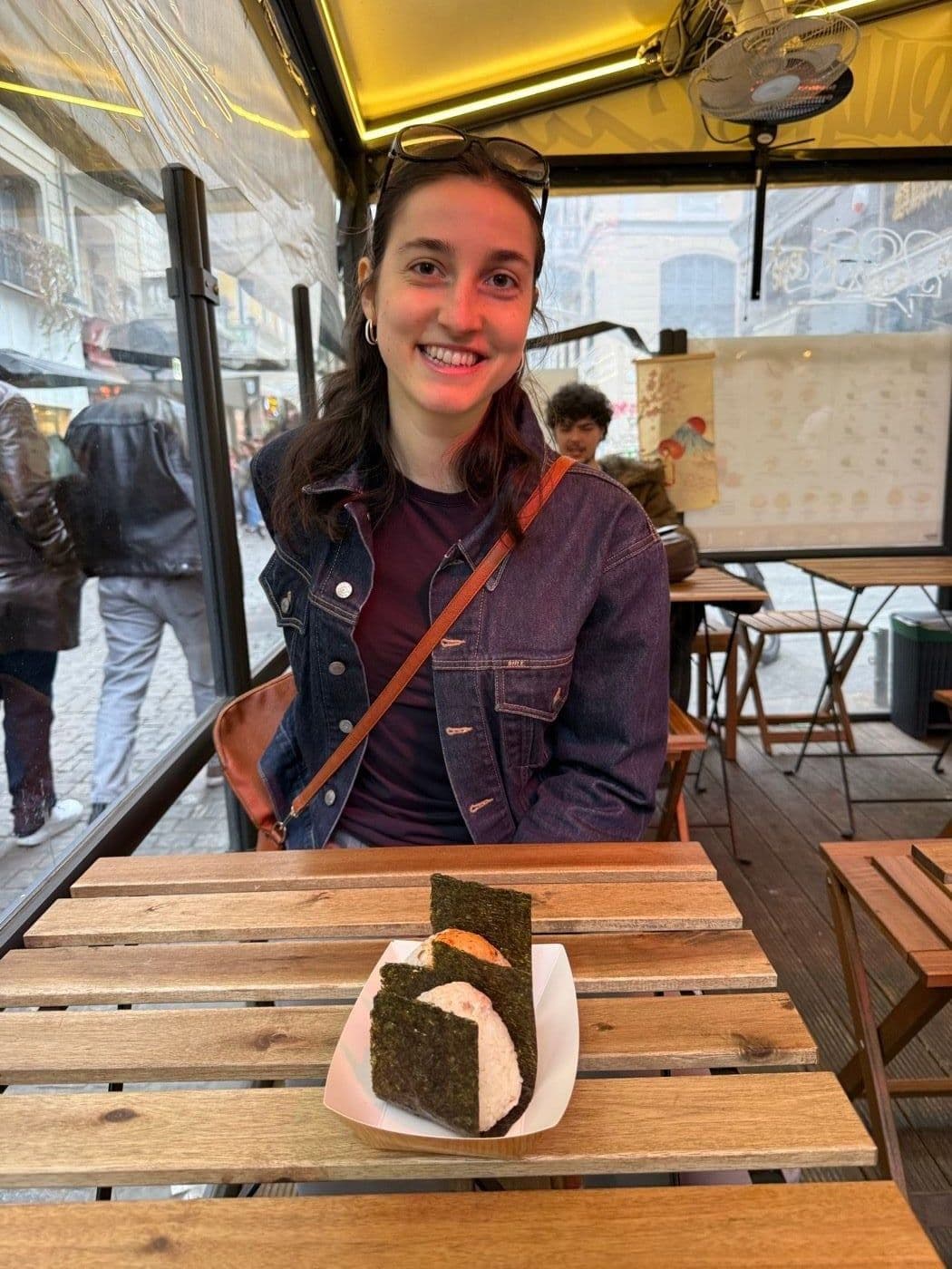 Emily, smiling, in a London venue